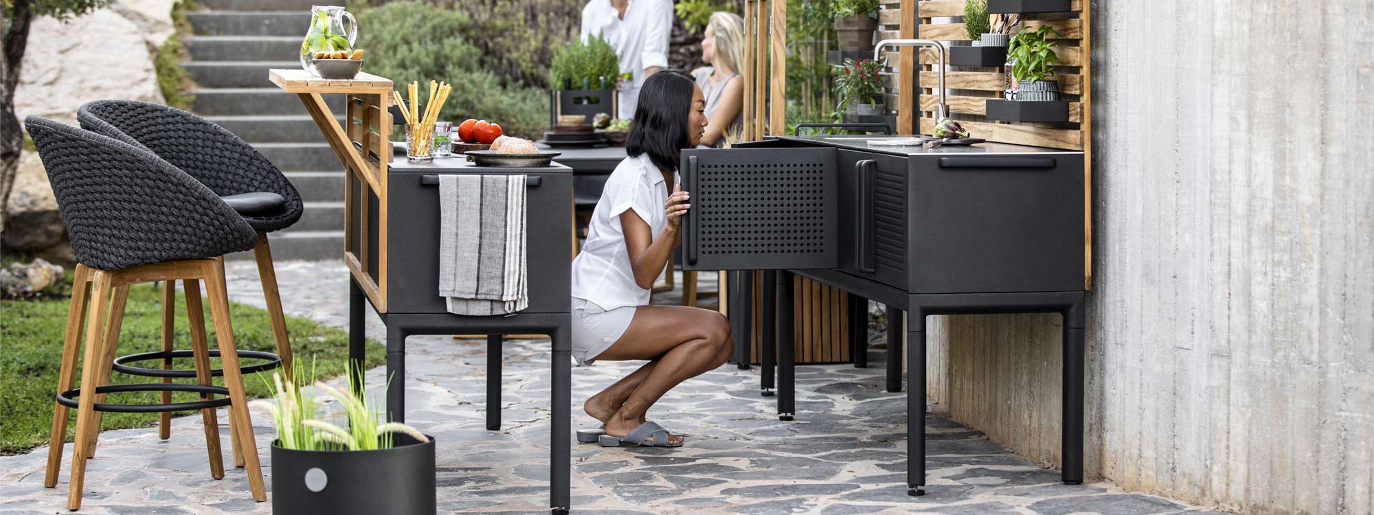 Peacock modern garden stool is a luxury outdoor bar chair in high quality exterior furniture materials by Cane-line garden furniture