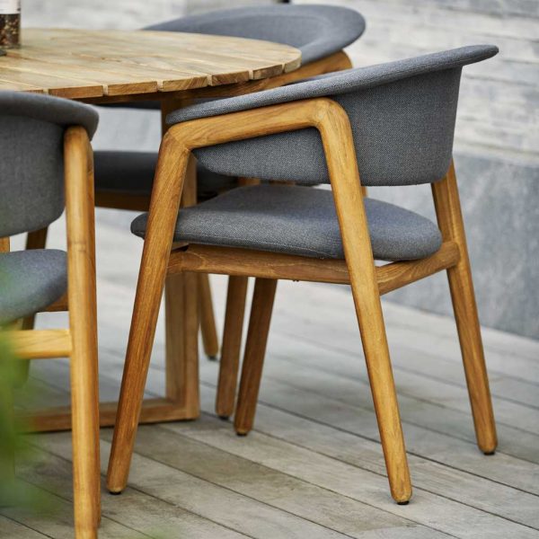 Luna teak garden dining chair is a modern outdoor chair in high quality garden furniture materials by Cane-line luxury exterior furniture.