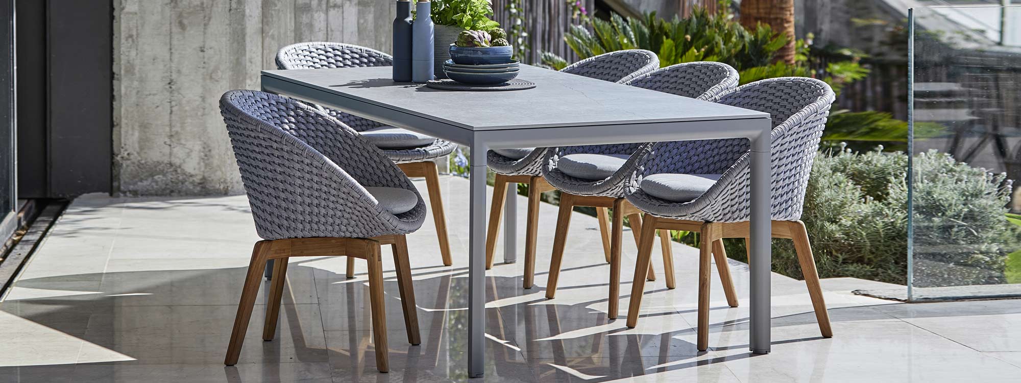 Drop Table & Peacock modern garden dining chair by Cane-line from Encompass