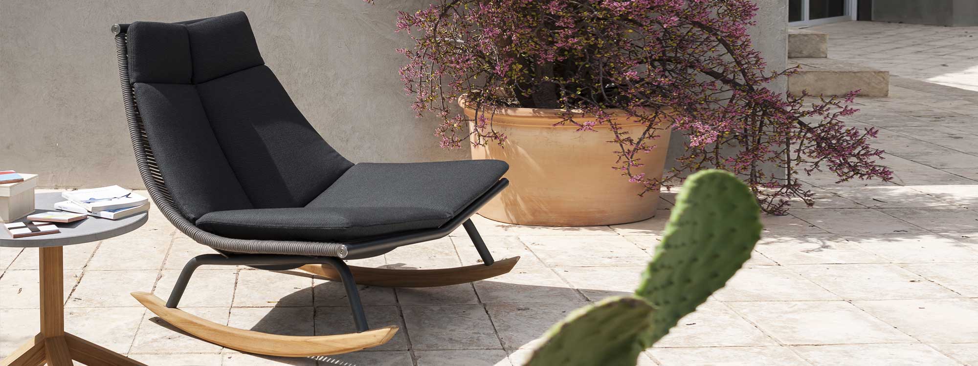Laze garden rocking chair with Smoke-coloured frame & Grey cord, on sultry Italian terrace