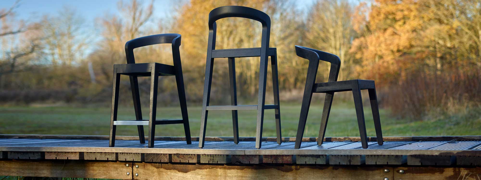 Play teak bar chairs are designed by Alain Berteau and are also available in a Black stained finish