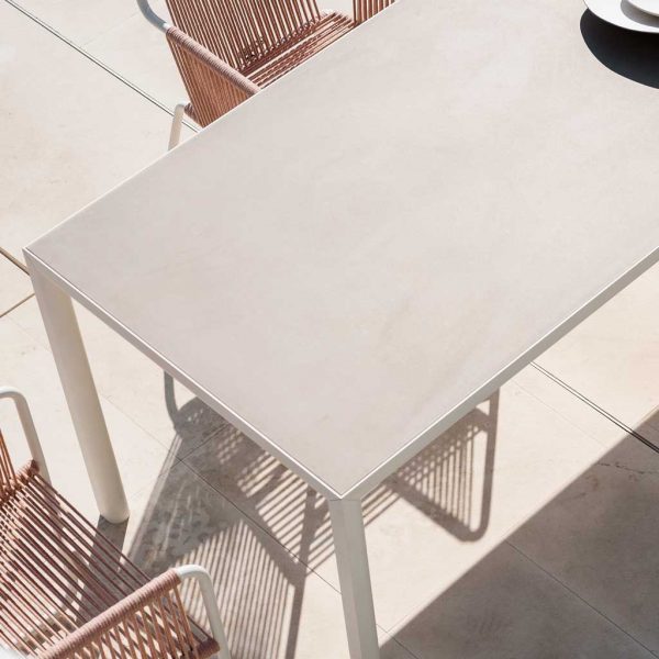 Birdseye view of Plein Air modern dining table and Harp garden chairs