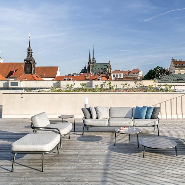Todus Starling lounge furniture on rooftop terrace in Czech Republic with church spires in background